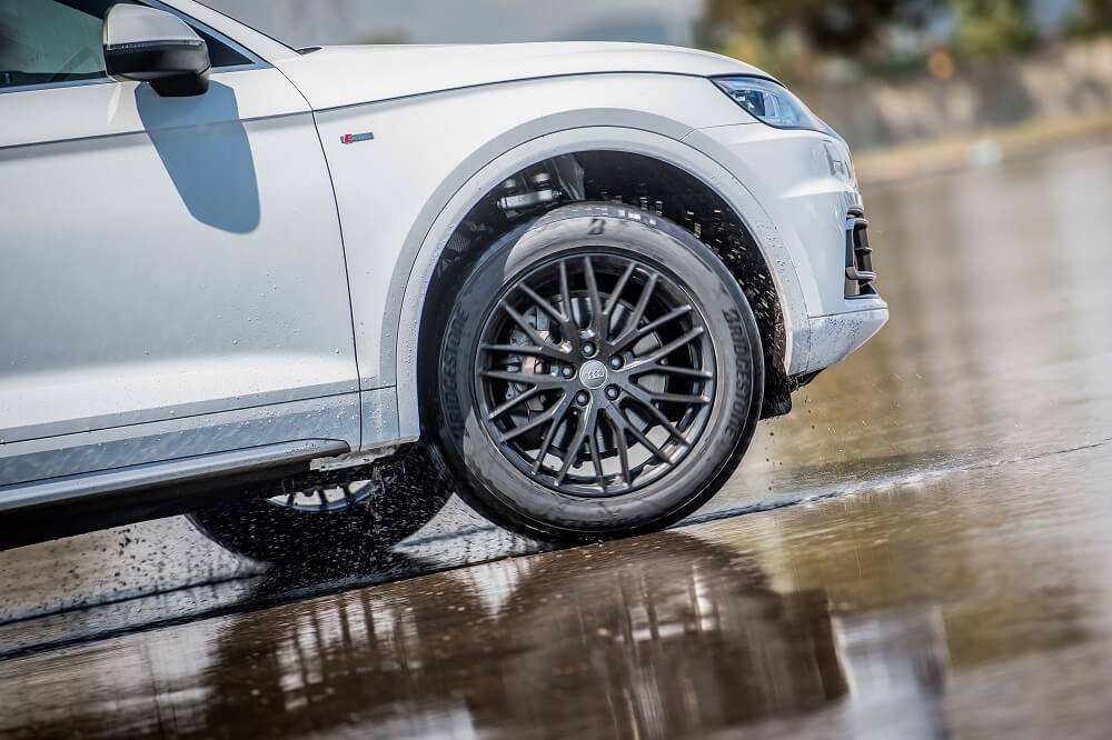 Artistic image of the new Potenza Sport driving through water.