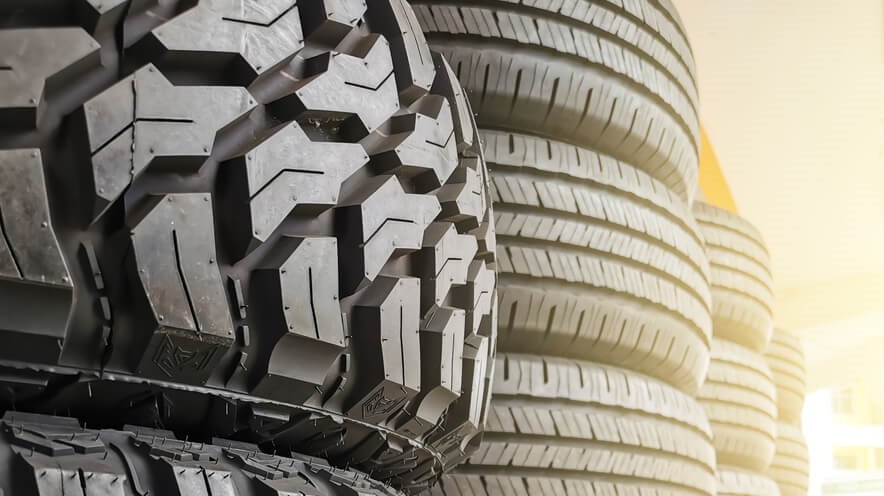 Close-up image of a new rubber tyre with textures.