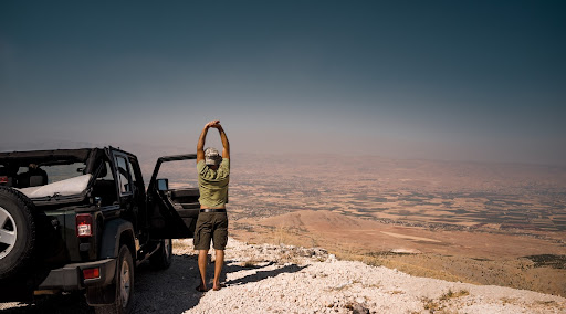 Stretching next to a car