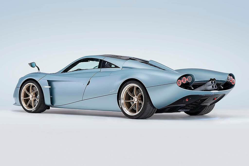 Studio image of the Pagani Codalunga from the side with a blue background.