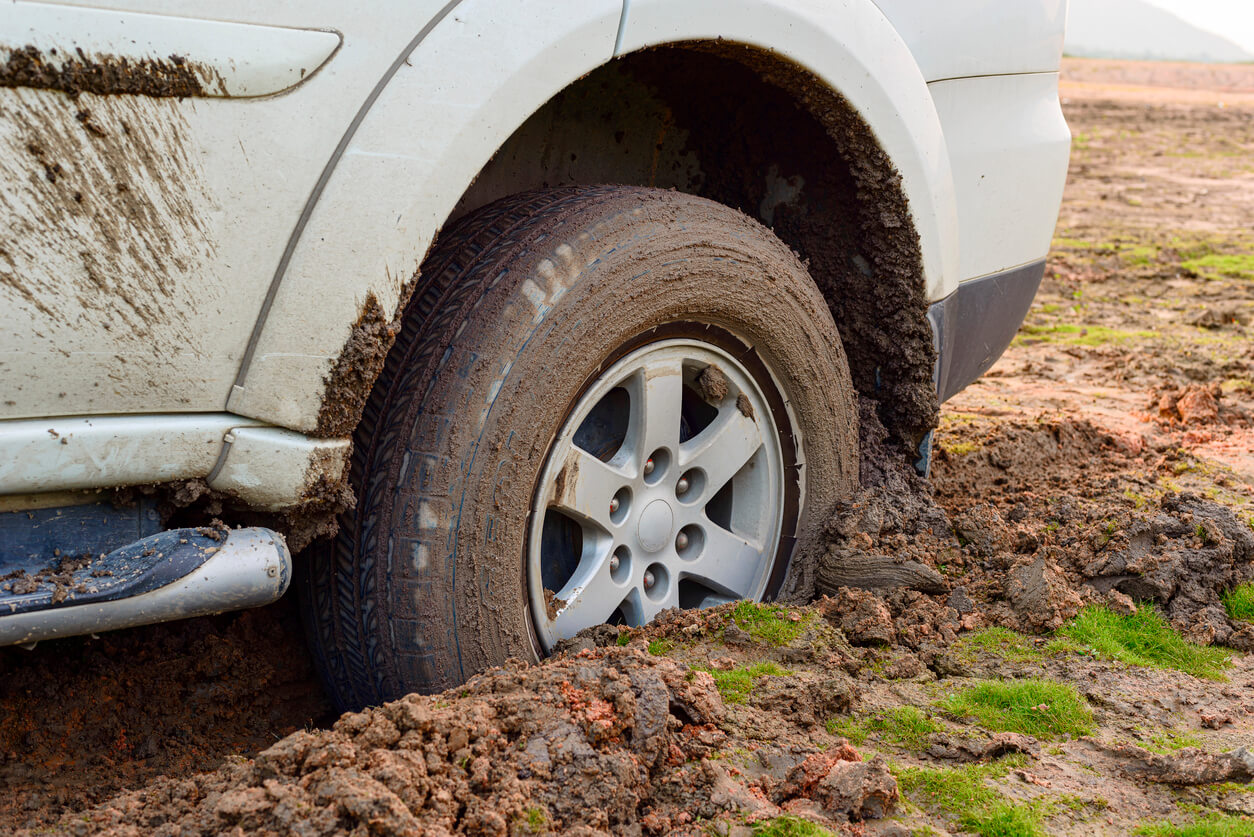 Highway terrain tyre stuck in mud.