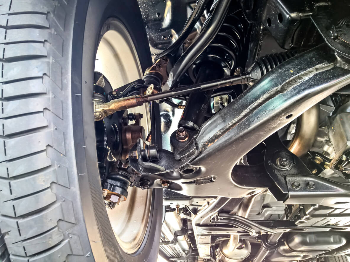 Vehicle’s suspension system double wishbone, shock absorber, and coil spring.