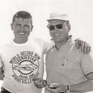 Black and white image of Mickey Thompson standing with Gene McMannis.