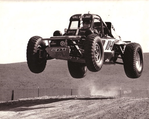 Black and white image of a bugger getting air from the 60’s