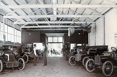 The Motor House, a warehouse showroom for cars and motorcycles.