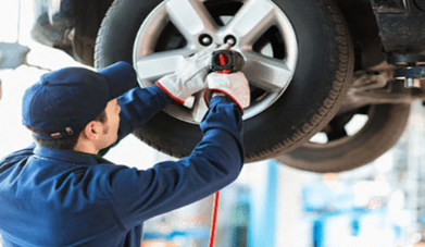 Man changing vehicle tyre