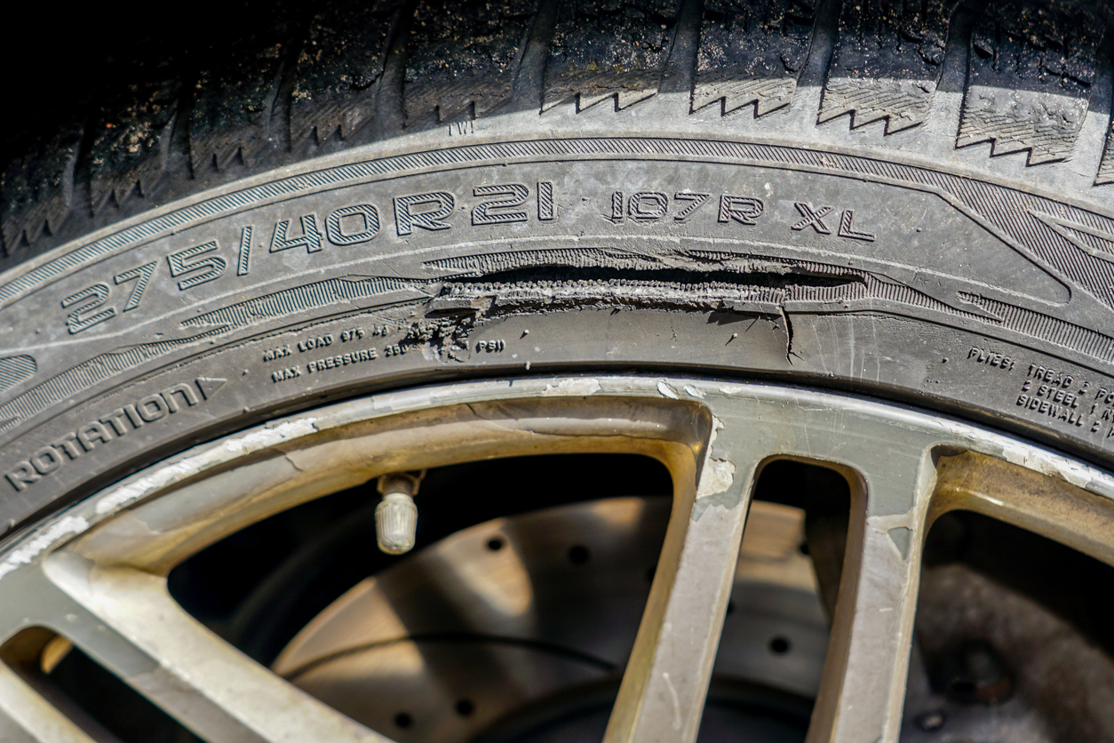 Badly damaged tyre sidewall.