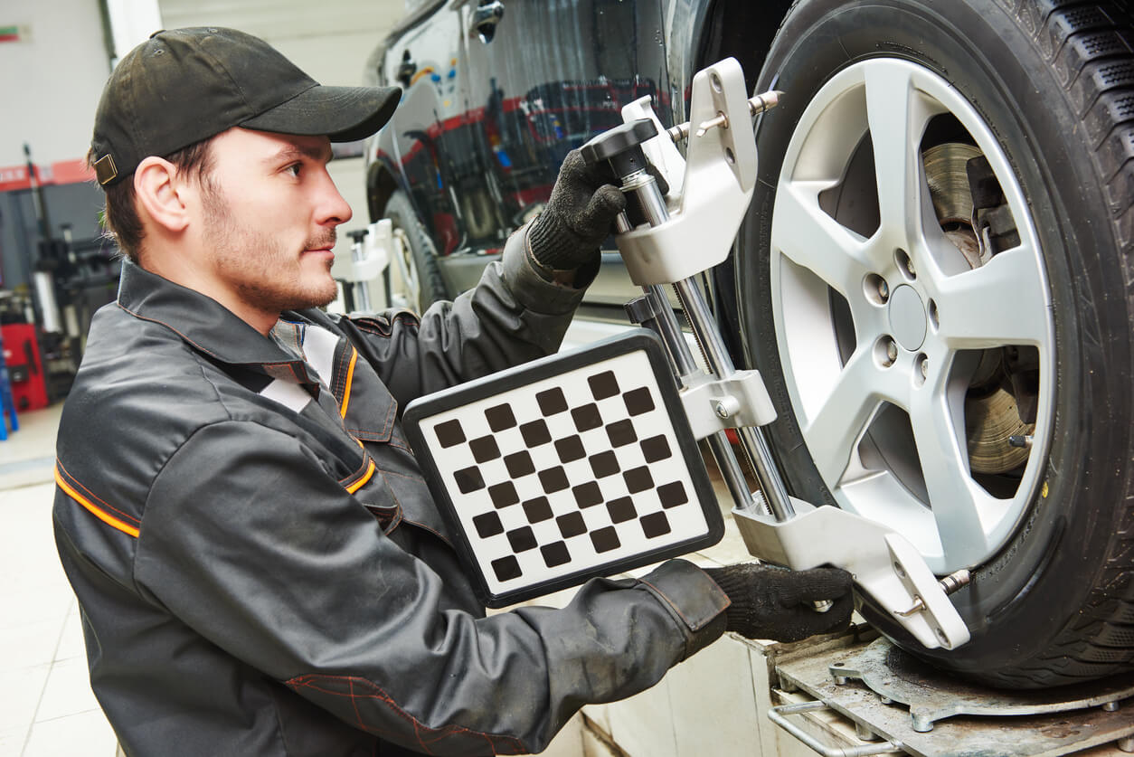 Automobile wheel alignment work at a repair service station